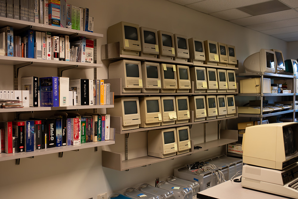 shelves and storage units filled with vintage hardware, software, and peripherals in the ELL restoration room